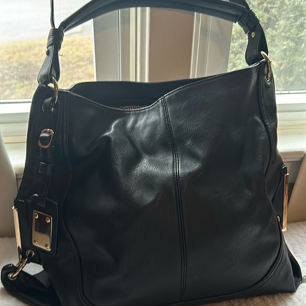 Woman’s black satchel bag